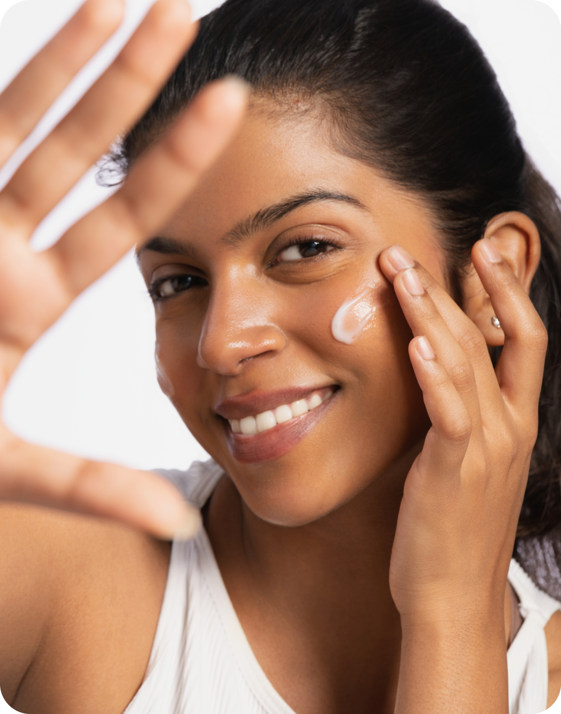 A man applying moisturizer